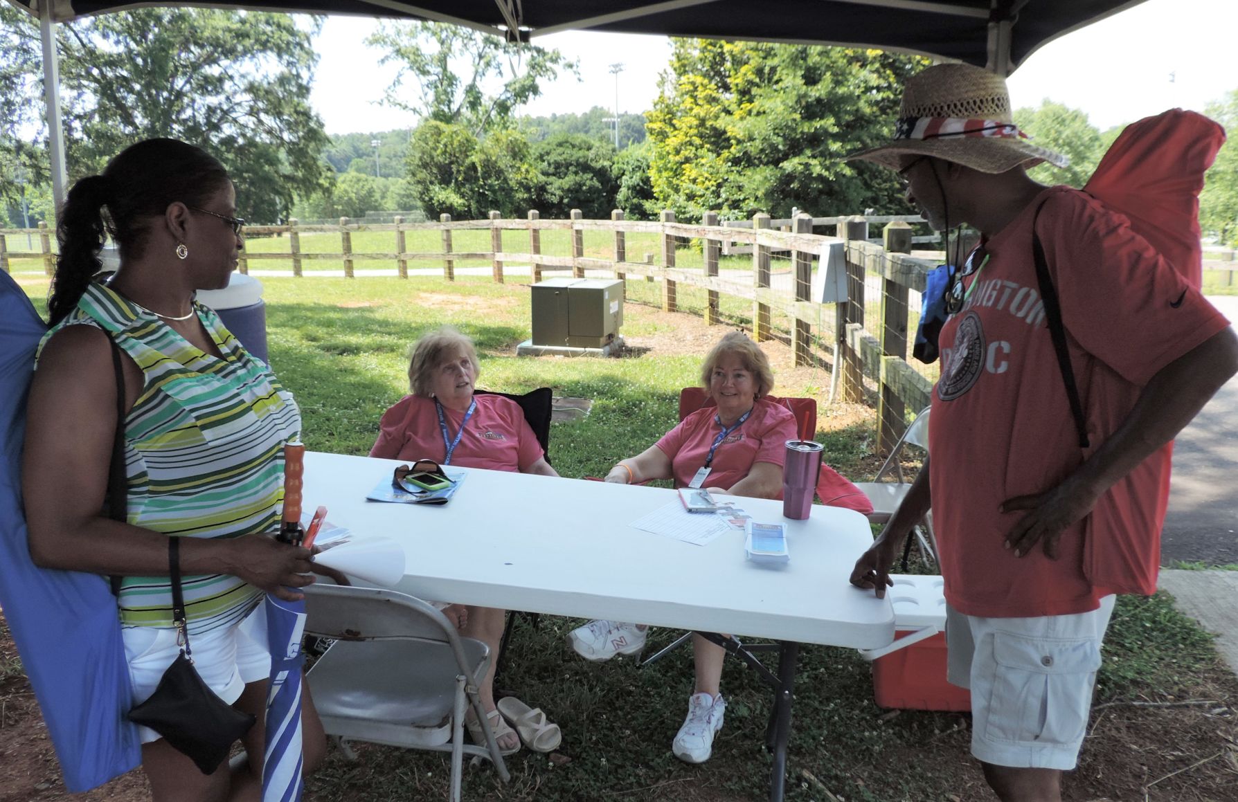 Sophia Kenyon and Susan Tucker welcome Michele Mackel and Alphonso McGlen.JPG